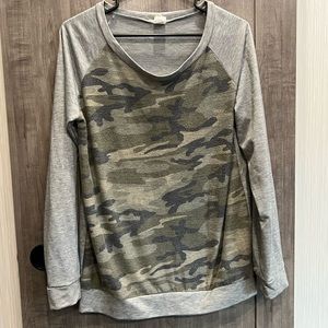 Womens long sleeve Camo, lightweight sweatshirt material.